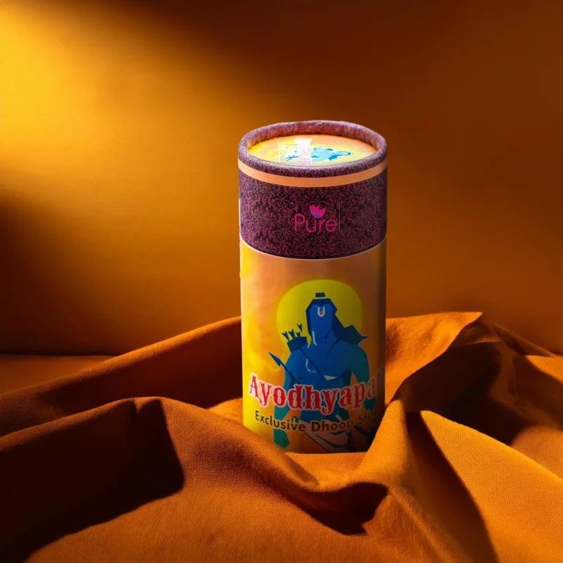 Special Ayoddhyapati Dhoop Canister with Lord Ganesha art, ideal for spiritual home décor, displayed on orange fabric background. – Devsamagri devotional product